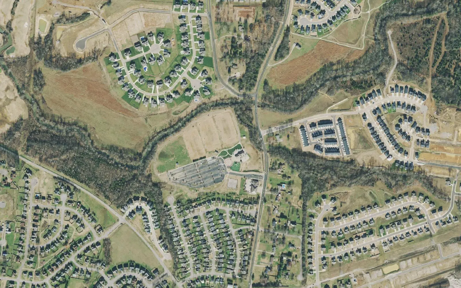 Fischer Park at Port Royal, with its ball fields, parking lot and pavilions, between subdivisions on Port Royal Road in south Spring Hill, in a 2021 aerial photograph.