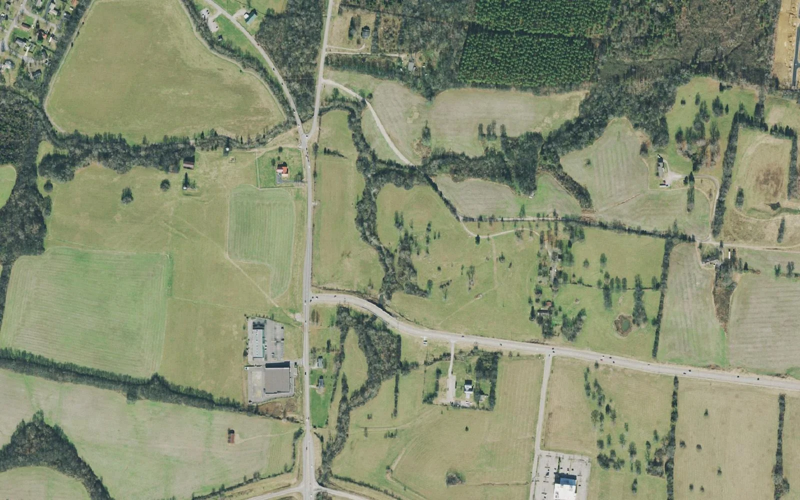 Open fields of the Spring Hill battlefield along Kedron Road, in a 2021 aerial photograph.
