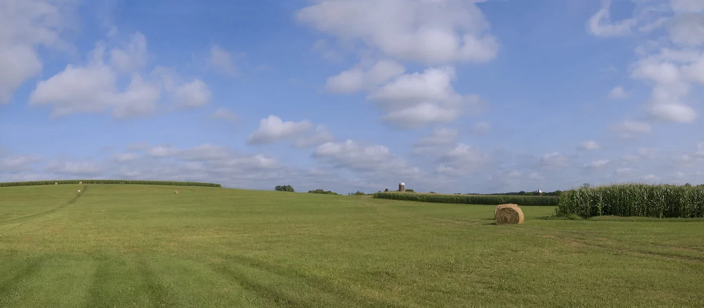 Open fields, hay bales and corn on the preserved Spring Hill battlefield off Kedron Road