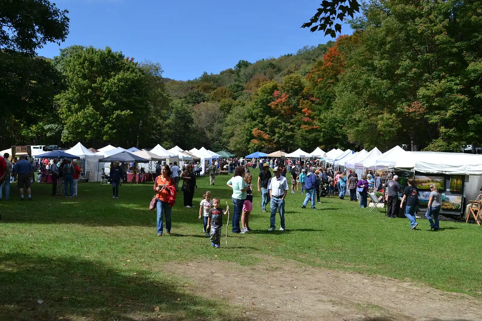 Craft vendors' tents line a lawn at a Virginia State Parks fall festival